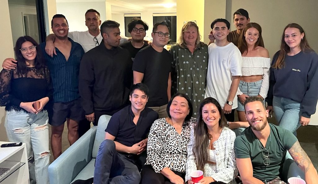 UBS Australia Team - photo of a diverse group of people in a living room